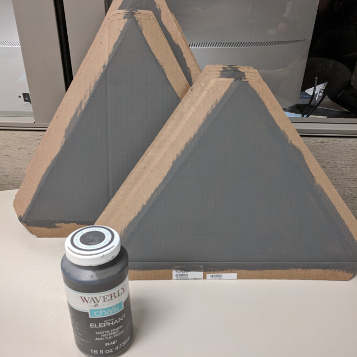 Grey triangles and the paint used on them.